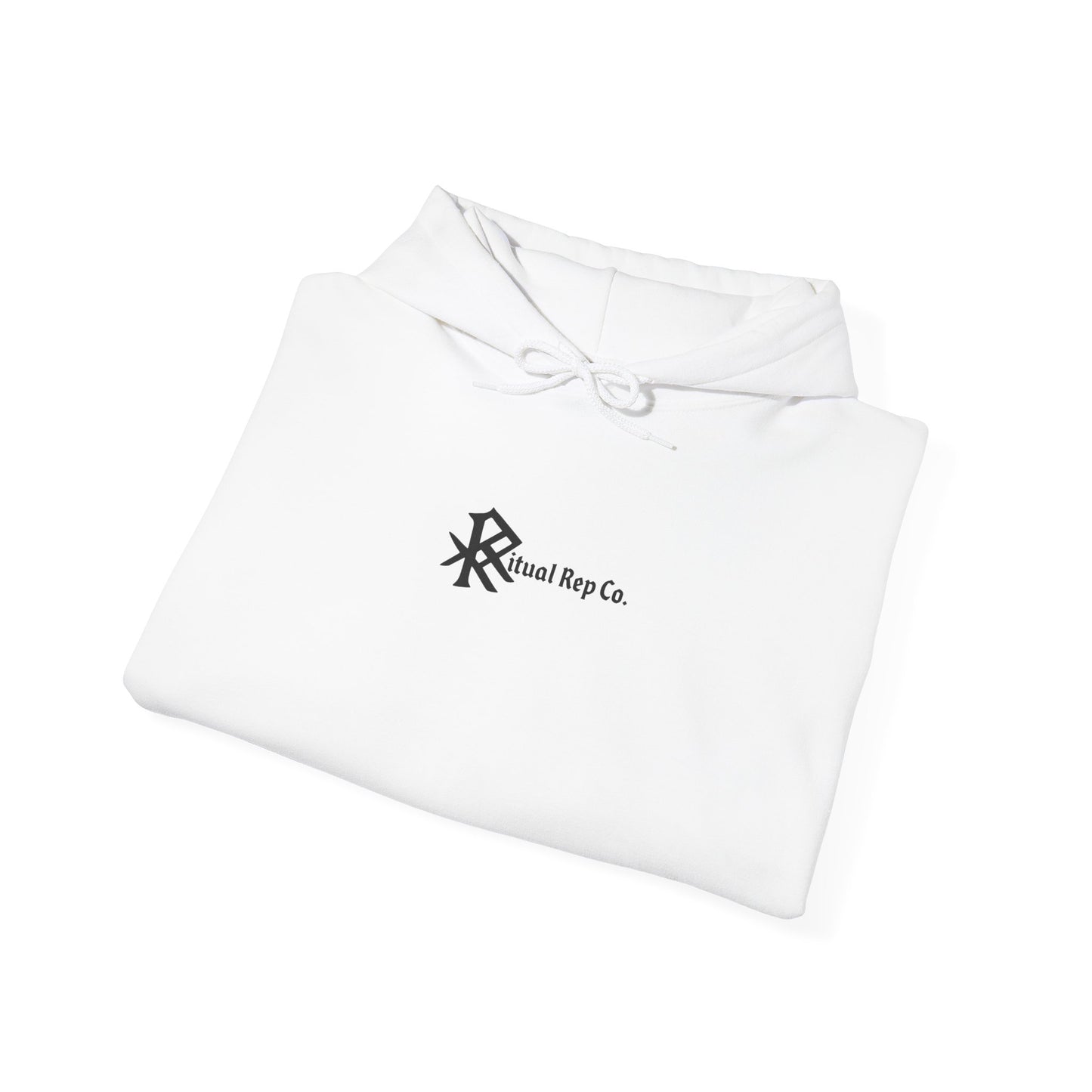 Folded white Initiate Hoodie with black Ritual emblem over heart.