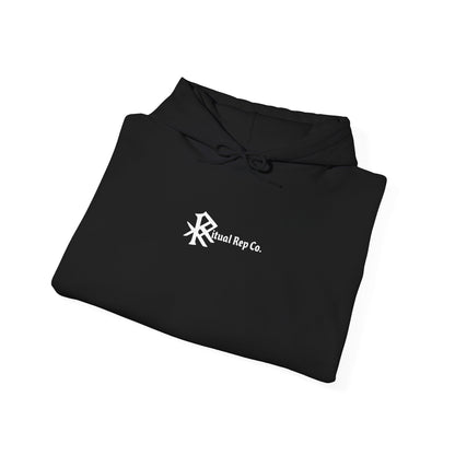 Folded black Initiate Hoodie with white Ritual emblem visible at chest position.